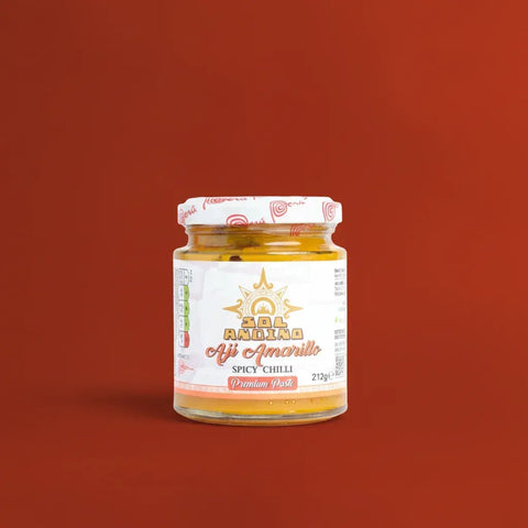 Jar of Aji Amarillo paste on a red background