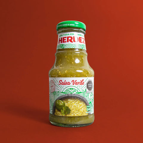 Herdez Salsa Verde bottle on a red background