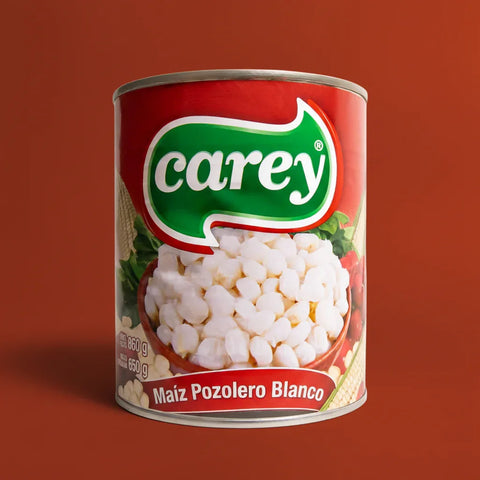 Can of Carey brand white pozole maize on a red background