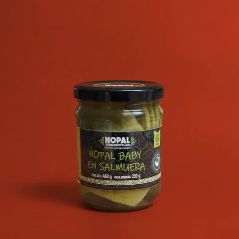 Jar of Nopal Baby en Salmuera on a red background