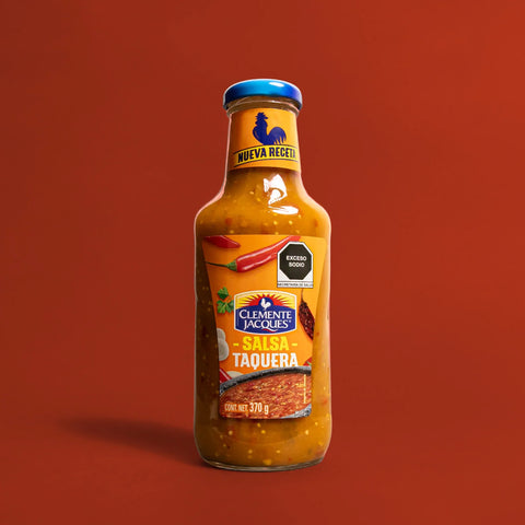 Bottle of Clemente Jacques Salsa Taquera on a red background