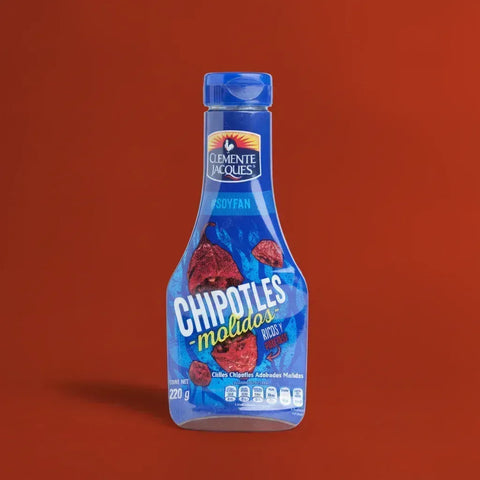 A blue bottle of Clemente Jacques Chipotle Relish on a red background