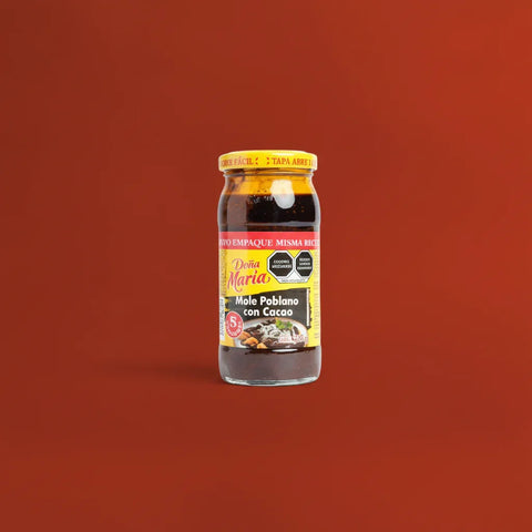 Jar of Dona Maria Mole on a red background