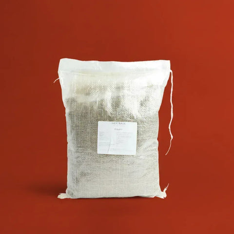 White drawstring bag of Oregano on a red background