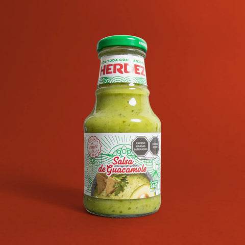 Bottle of Herdez Salsa de Guacamole on a red background