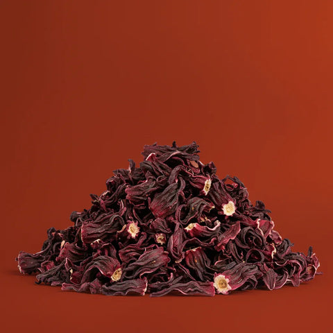 Stack of dried hibiscus flowers on a brown background