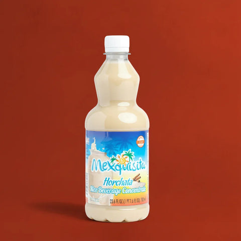 Bottle of Mexiquisita Horchata rice beverage concentrate on a red background