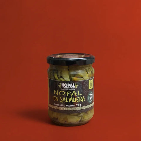 Jar of sliced cactus on a red background