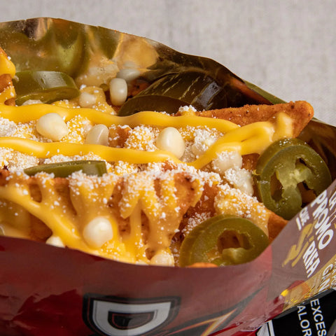 Open bag od doritos with jalapenos, corn and cheese sauce