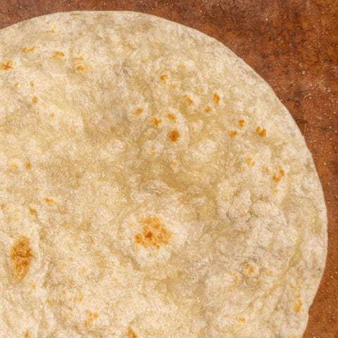 Close-up of a tortilla with a brown background