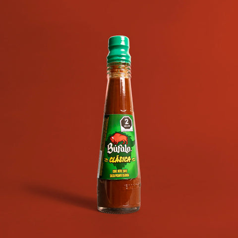 Bottle of Buffalo Classic hot sauce on a red background